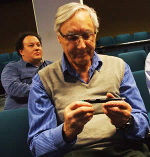 Roger inspectes the pen